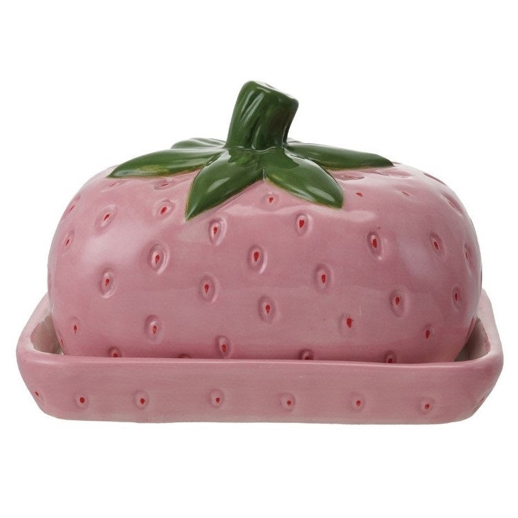 The HAND-PAINTED CERAMIC STRAWBERRY SHAPED BUTTER DISH by CREATIVE COOP features a pink strawberry design with a green leafy top, hand-painted details, and comes on a matching pink rectangular base.
