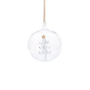 The ZODAX CLEAR GLASS BALL ORNAMENT WITH TREE INSIDE is a 4-inch ornament featuring a white glass Christmas tree topped with a gold star, suspended by a beige ribbon, beautifully displayed against a white background.