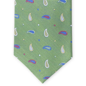 The BIRD DOG BAY PETER-BLAIR Bespoke Paisley Soiree Silk Tie in green features a small paisley pattern in blue, white, and red with colorful dots, handmade and shown rolled up on a white background.