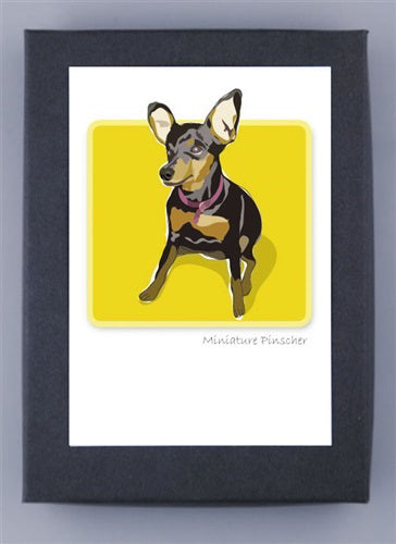 This depiction of a Miniature Pinscher on a yellow backdrop highlights its large ears, black and tan coat, and collar. Presented in a sleek black frame, the phrase &quot;Miniature Pinscher&quot; appears below. It&#39;s printed on premium recycled paper made in the USA by PAPER RUSSELLS - MINIATURE PINSCHER BOX NOTES.