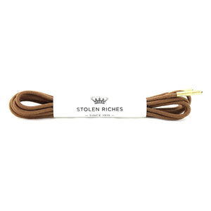 STOLEN RICHES - Dress Shoelaces in Gipper Brown feature premium brown laces with gold tips, neatly coiled and wrapped by a white band labeled "Stolen Riches Since 1915" beneath a crown logo.