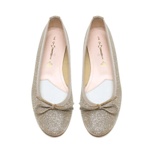 A pair of MICHELE LOPRIORE - MIA BALLET FLAT shoes by MICHELE LOPRIORE, featuring glittery silver leather with small bows on the front, displayed against a plain white background. Made in Italy, these shoes boast a low heel and a sleek, shiny texture.