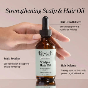 A dropper bottle and box of KITSCH - STRENGTHENING HAIR & SCALP OIL, featuring rosemary and biotin for dry scalp and hair, in a 2 fl. oz. size, are displayed against a simple light background. This plant-based formula by KITSCH is designed to support scalp health and strengthen hair.
