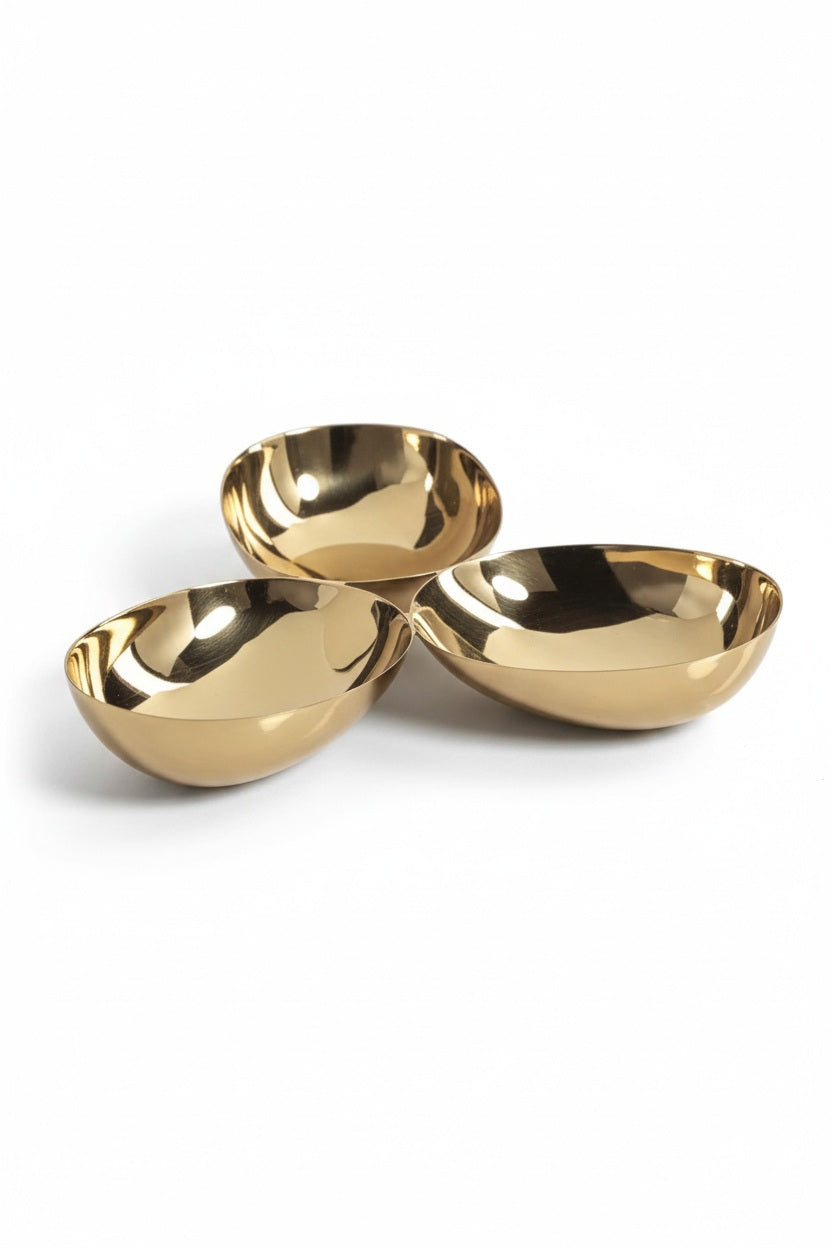 ZODAX TRIPLE NUT BOWL IN POLISHED GOLD featuring three connected 7-inch gold-toned bowls arranged in a cluster.