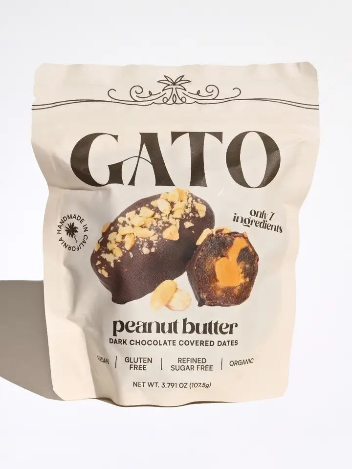 A beige bag of GATO DATES - CHOCOLATE COVERED PEANUT BUTTER DATES from GATO DATES, featuring an image of the product on the packaging. Highlights include vegan, plant-based, gluten free, refined sugar free, organic, and only 7 ingredients. Net weight: 3.79 oz.