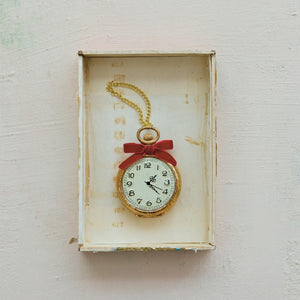 POCKET WATCH ON CHAIN ORNAMENT designed as an antique-style gold pocket watch hanging from a chain, decorated with a red velvet bow.