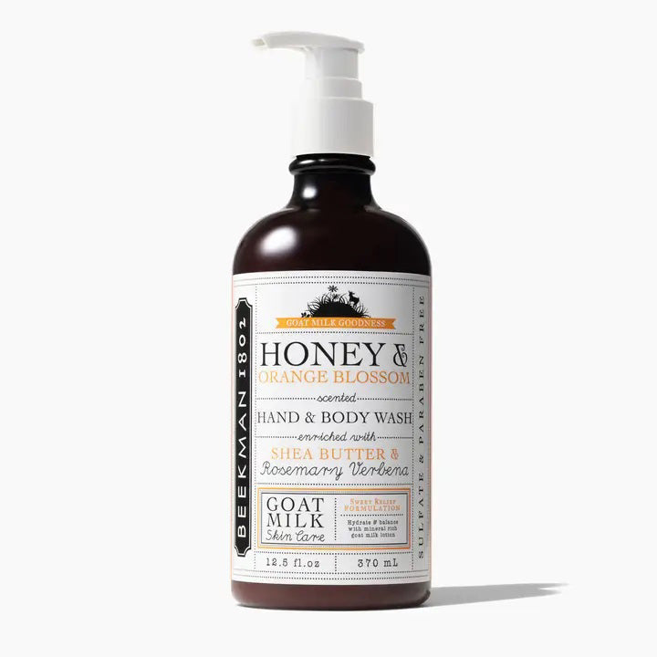 The BEEKMAN - STA ELEMENTS Honey and Orange Hand and Body Wash is perfect for sensitive skin. This 12.5 fl oz product comes in a brown bottle with a white label featuring black and orange text, as well as a white pump dispenser. Enriched with shea butter, rosemary verbena, and nourishing goat milk.