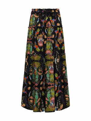 The FRANCO FERRARI Cotton Tiered Max Skirt is an A-line maxi skirt featuring large abstract orange, green, and blue flowers on a light background. Made from cotton, it offers comfort with an elasticized drawstring waist for an adjustable fit.