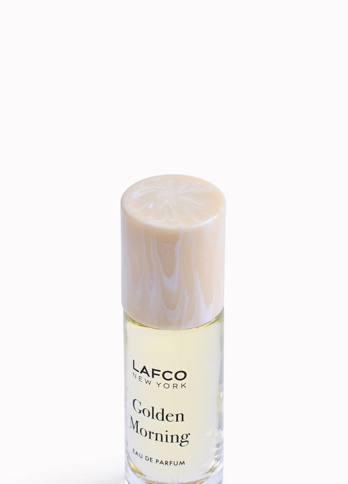 Housed in a clear glass bottle with a beige cap and minimalist black labeling, LAFCO Fine Fragrance Golden Morning 10ml is a floral perfume delicately crafted with essential oils for a fresh, uplifting scent.