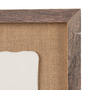 The CREATIVE COOP WOOD FRAMED PLASTER CAST BOTANICAL WITH JUTE MAT features four raised flower stems on a rectangular white panel, adding botanical wall art charm to any room.