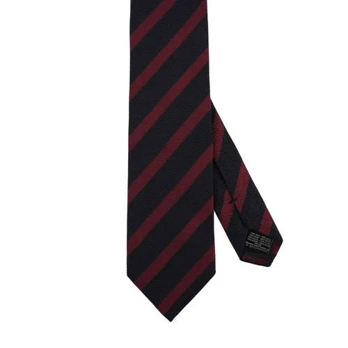 The AMANDA CHRISTENSEN Striped Jacquard Woven Silk Tie in wine red, a men’s formal accessory by AMANDA CHRISTENSEN, features diagonal black and dark red stripes and is displayed rolled up on a white background.