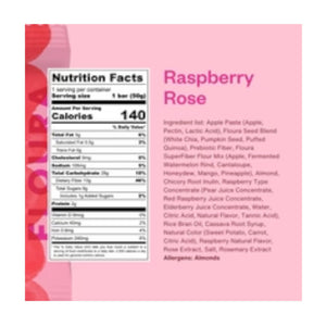 A pink wrapper for FLOURA & CO’s RASPBERRY ROSE FLOURA FIBER CRUSH BAR features bold red circles and product text. This 1.8 oz (50g) gut health snack contains 13g fiber and is a delicious, high-fiber bar.