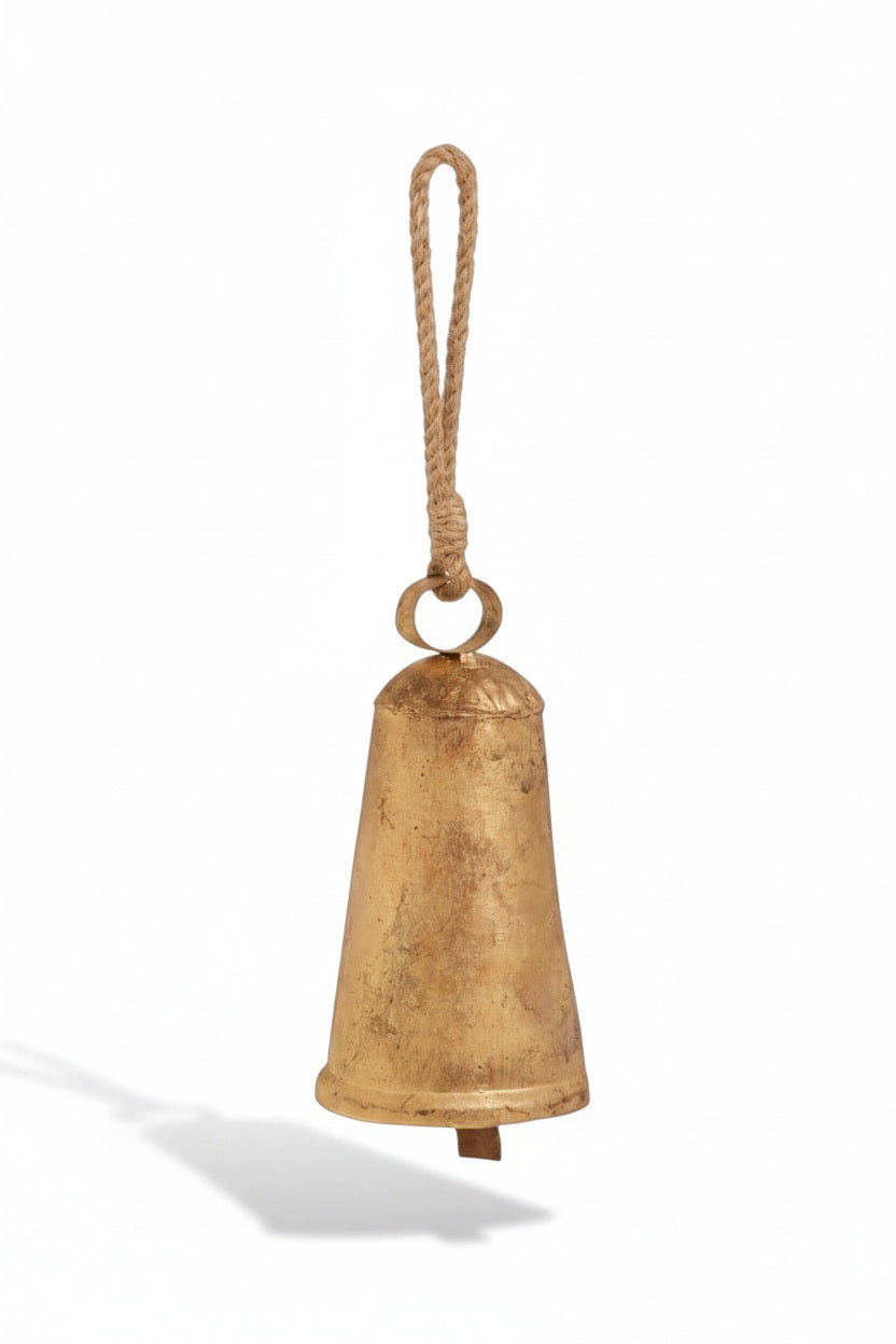 RUSTIC GOLD BELL 8″ made of distressed gold-colored iron and jute, hanging from a jute rope loop.