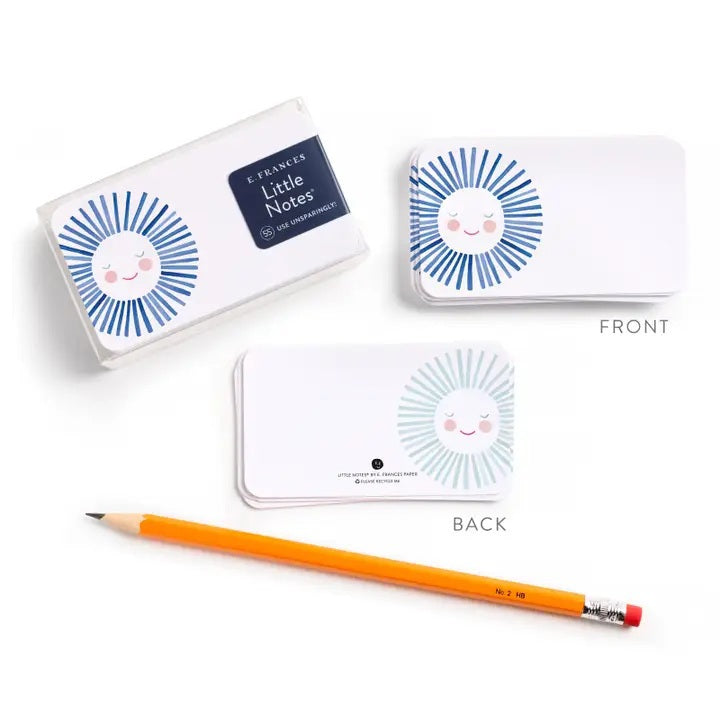 The E. FRANCES - LITTLE NOTES BLUE SUNSHINE mini card features a smiling, hand-painted watercolor sun with a white face, pink cheeks, closed eyes, and light blue rays. Text below: "Little Notes by E. Frances Paper. Please Recycle Me.