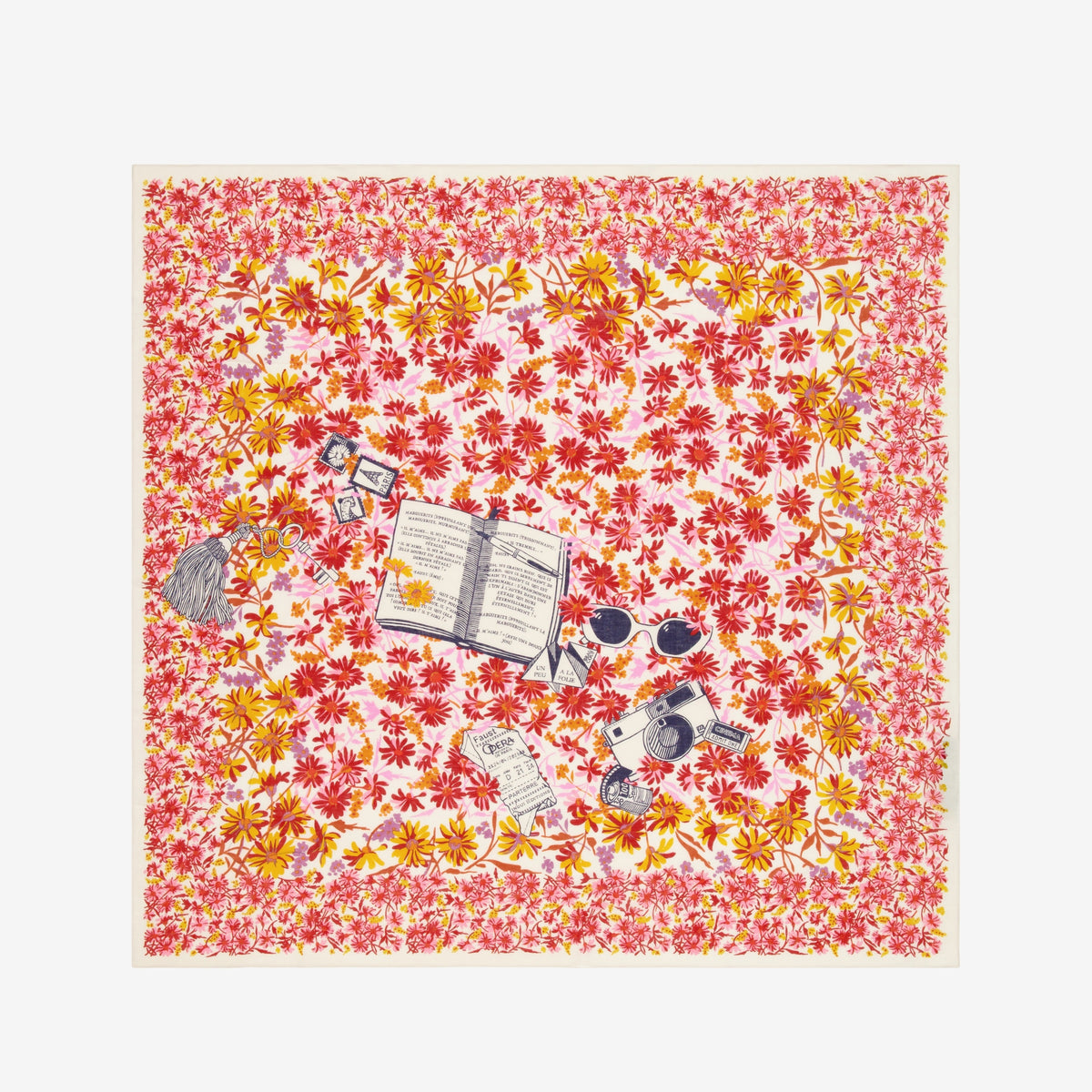 The INOUI EDITIONS - FAUST SCARF IN PINK by INOUI is a cotton square scarf decorated with red, yellow, and pink flowers plus illustrations of an open book, sunglasses, camera, hairbrush, photos, and tickets—a versatile accessory.