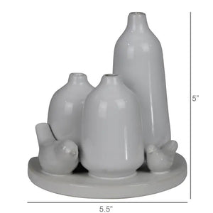 The HOMART CERAMIC VASE TRIO WITH TWO BIRDS features three matte white minimalist vases of varying heights and two bird figurines on a 5.5-inch round base; tallest vase stands 5 inches—ideal for bird vase decor.
