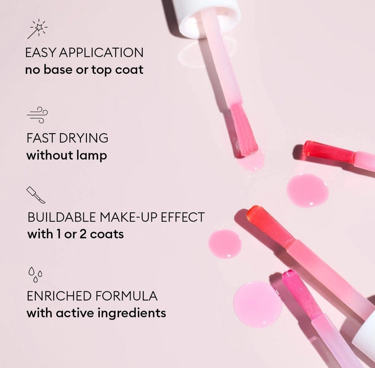 A pink serum drop labeled with its ingredients: raspberry extract (strengthens nails), AHAs (restore and harden), and sweet almond oil (nourishes). The text highlights that MANUCURIST - ACTIVE GLOW CARE POLISH by MANUCURIST INC is 85.5% plant-based—making it the ideal nail strengthener for achieving healthy, glass-like nails.