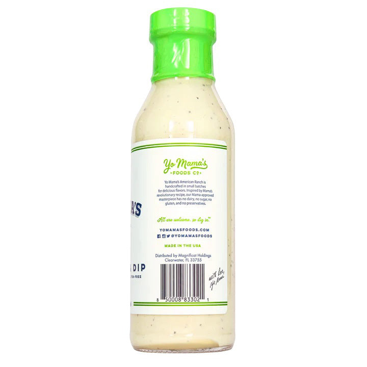 A bottle of YO MAMA'S - AMERICAN RANCH from YO MAMA'S FOODS is displayed against a white background. The green-capped bottle, labeled "dairy-free, gluten-free," and "no sugar added," contains 13 oz (368g) of hand crafted Ranch Dressing &amp; Dip.