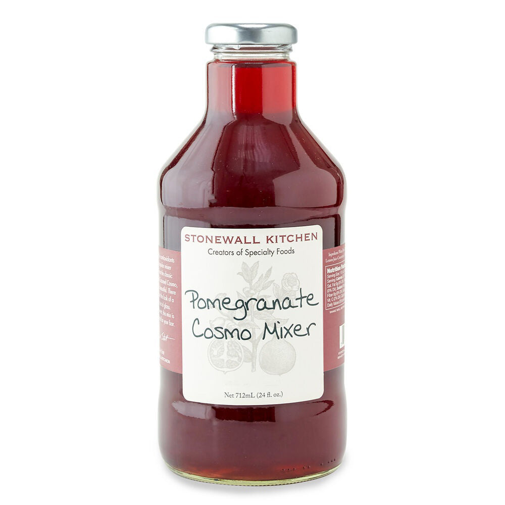A clear glass bottle filled with deep red liquid, labeled "STONEWALL KITCHEN - POMEGRANATE COSMO MIXER." The bottle has a metal cap and a white label featuring images of pomegranates, perfect for crafting the ultimate pomegranate martini.