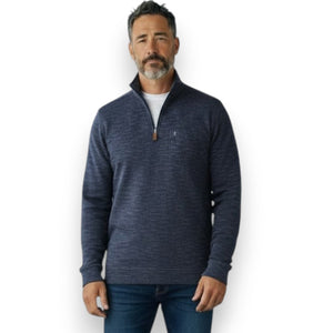 Close-up of the CRIQUET - Crossroads Pullover in Moody Blue, a men’s quarter-zip featuring a slub rib knit texture and leather zipper pull, layered over a white shirt. The brand name “CRIQUET” appears prominently across the center of the image.