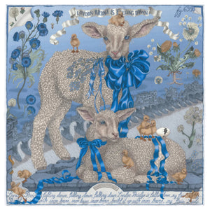 The SABINA SAVAGE - LONDON BRIDGE IS FALLING DOWN SILK TWILL SCARF 42CM POWDER/FROST from SABINA SAVAGE ENGLAND is artfully folded into a floral shape, showcasing a blue and white pattern with flowers, baby lambs, and intricate details bordered by a bold blue.