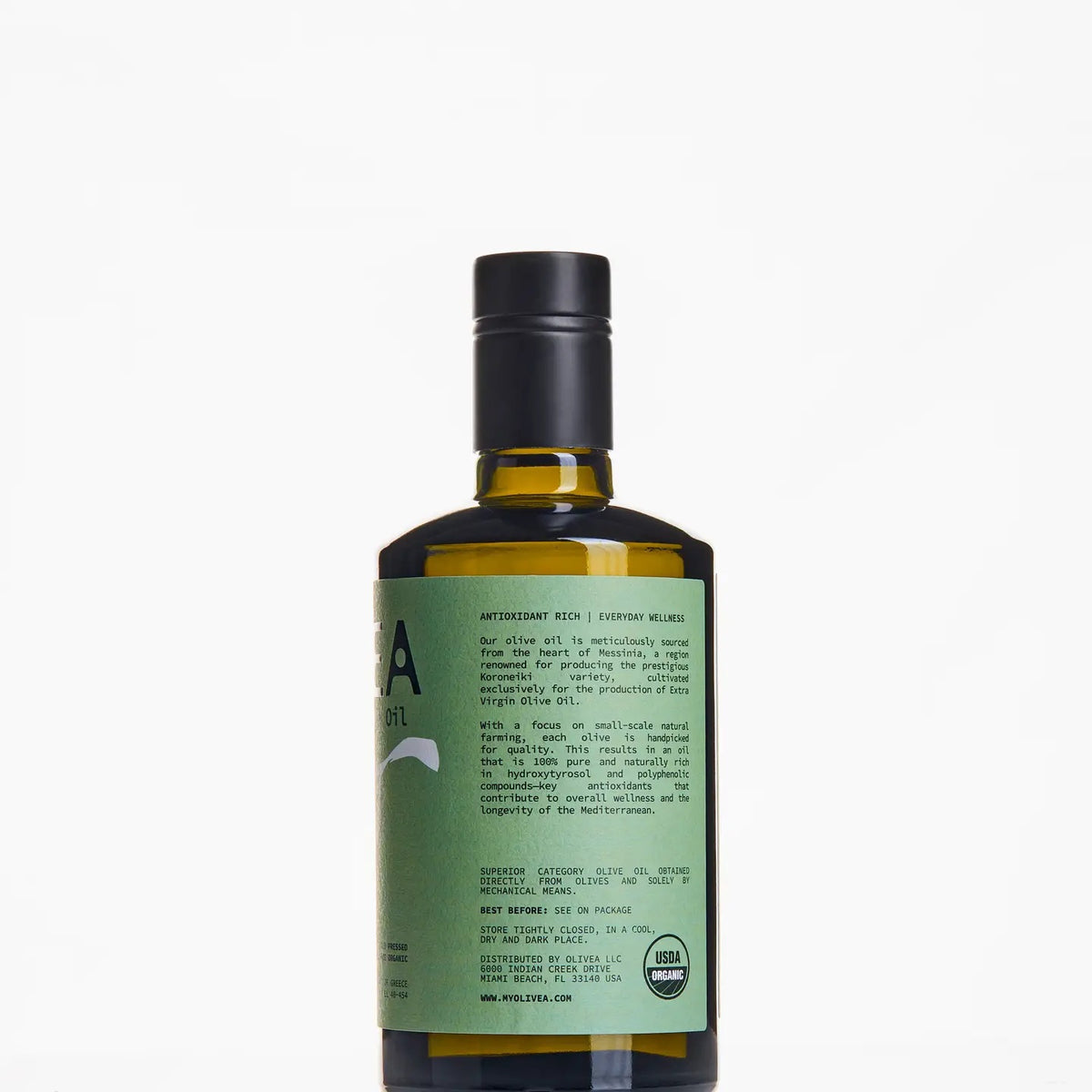 A bottle of OLIVEA - EVERYDAY HIGH PHENOLIC EXTRA VIRGIN OLIVE OIL, crafted from Greek olives and featuring a green label adorned with an olive branch illustration, is set against a plain white background. This USDA Certified Organic product from OLIVEA ensures purity and exceptional flavor in every drop.
