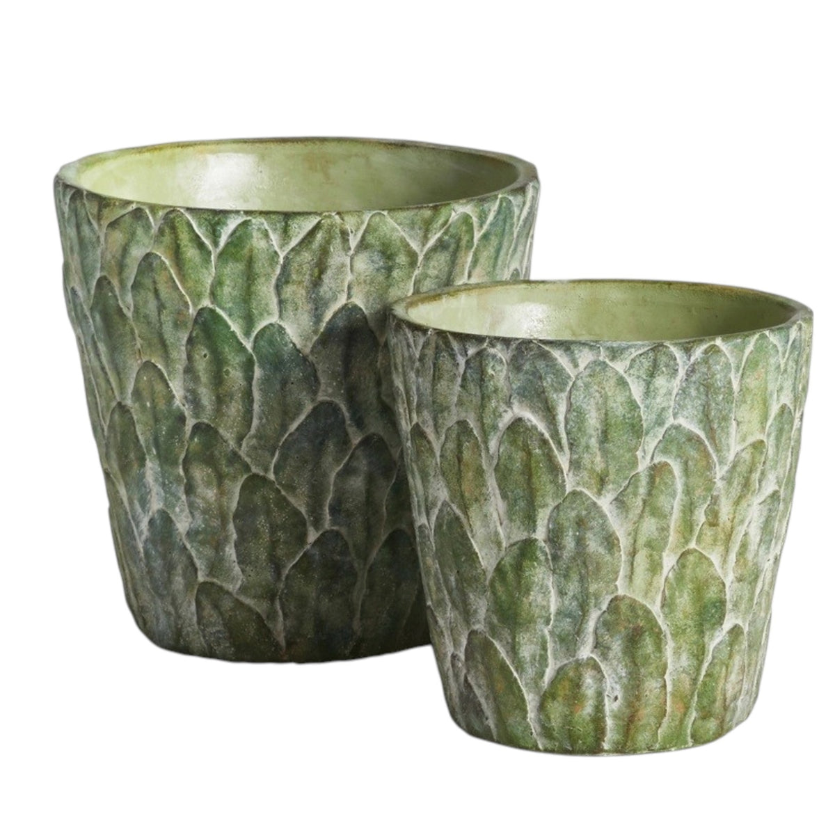 The NAPA HOME AND GARDEN - FELDBURG POT, LARGE is a green ceramic cachepot with a textured, leaf-like pattern and a slightly flared rim, perfect for adding decorative charm to your space.