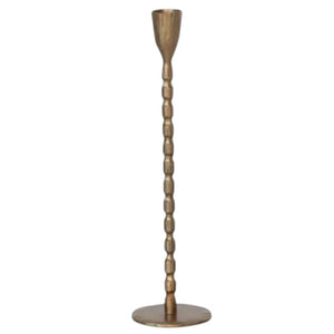The CREATIVE COOP Cast Iron Taper Holder in Brass Finish, Small, features a slender design with a textured beaded stem and round flat base, perfect for modern minimalist decor.