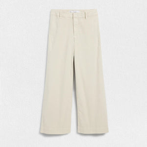 The FRANK & EILEEN Wexford Wide Leg Linen Pants in Cement are showcased against a light textured background. These Italian Performance Linen pants feature a fitted waist with belt loops and a zip fly with button closure. The bottom hems are neatly finished, providing a clean, tailored appearance.