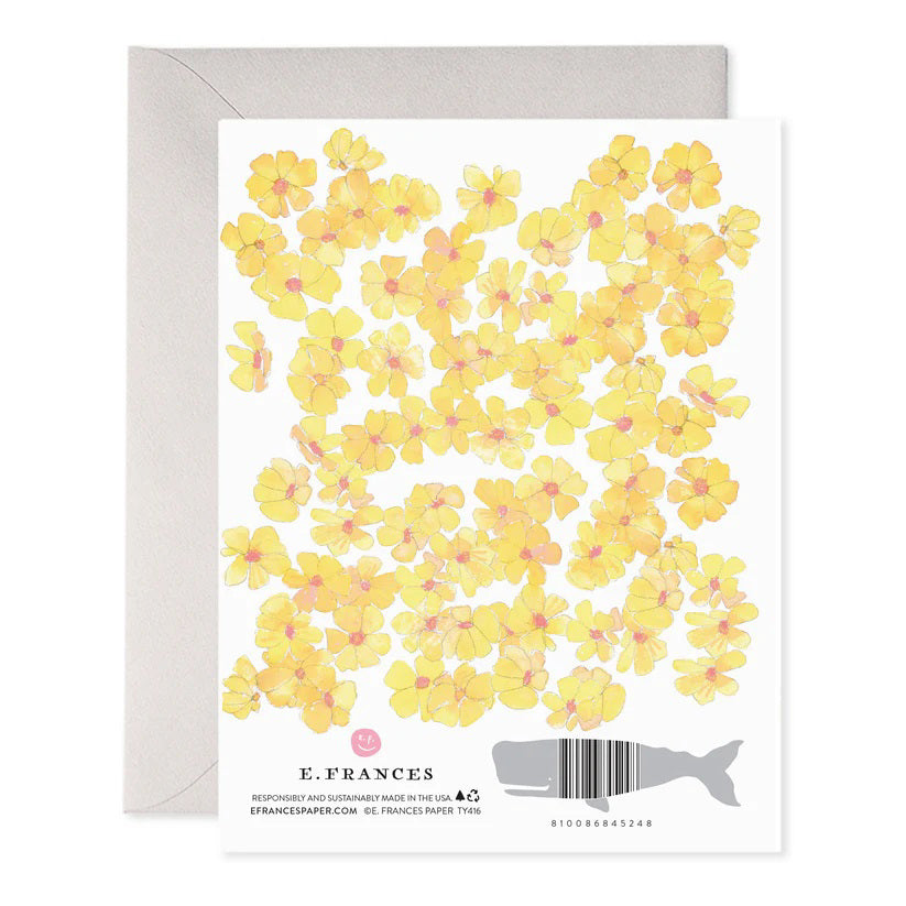 The E. FRANCES PAPER - YELLOW FLOWERS THANK YOU GREETING CARD features floral illustrations of yellow flowers with pink centers and "Thank You" written in uppercase letters among the blossoms, complete with an envelope.
