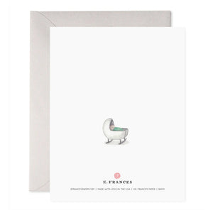 The E. FRANCES PAPER - NEW MAMAS ROCK GREETING CARD features a handcrafted watercolor of a rocking chair with a light green cushion, alongside the words "New mamas rock and rock and rock and love and love and love." An envelope is slightly visible behind the card.