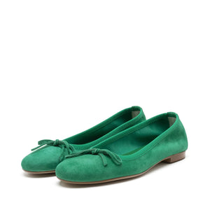 A pair of MICHELE LOPRIORE - MIA BALLET FLAT shoes by MICHELE LOPRIORE, featuring glittery silver leather with small bows on the front, displayed against a plain white background. Made in Italy, these shoes boast a low heel and a sleek, shiny texture.