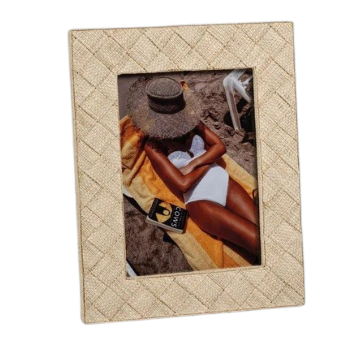 Two beige LA BOCCA WOVEN RAFFIA FRAMES by ZODAX rest on a gray surface. One 5x7 natural raffia photo frame holds an image of a person relaxing by the beach, while the other displays someone wrapped in an orange scarf. Both images are partially obscured, lending a subtle and organic touch to your home decor.