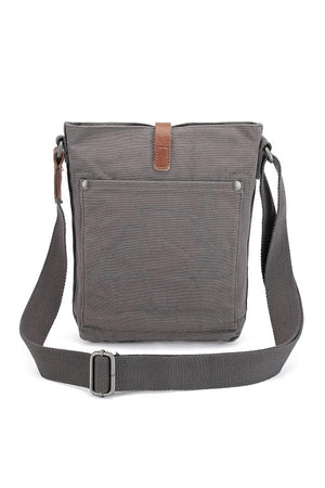 The TSD BRAND Forest Zip Crossbody Bag in Grey features a wide black strap, brown leather buckle accent, metal rivets, and a subtle side logo tag for a military-inspired look.