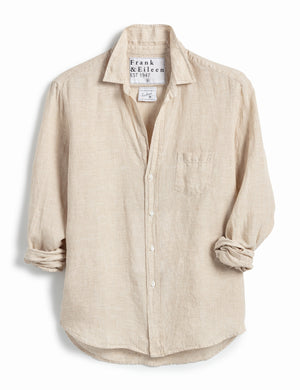 The FRANK & EILEEN Eileen Relaxed Button Up in Ashed Linen Sand features rolled-up sleeves, a relaxed fit, single chest pocket, and visible label inside the collar against a white background.