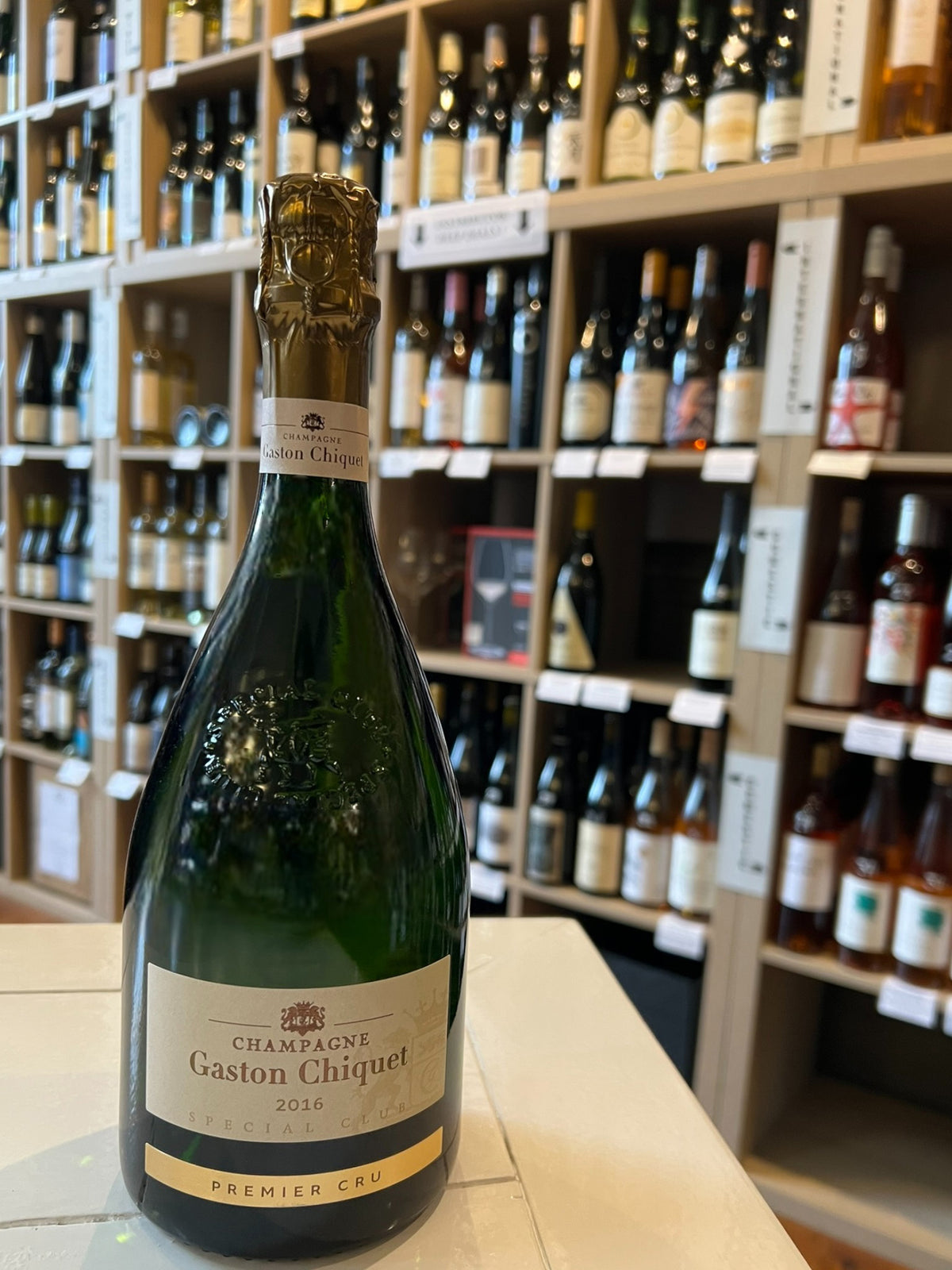 A bottle of GASTON CHIQUET SPECIAL CLUB 2016 by WINE: BORDEAUX FINE &amp; RARE/A-VIN-GARDE, featuring a gold foil top and cream label, displayed against a white background.