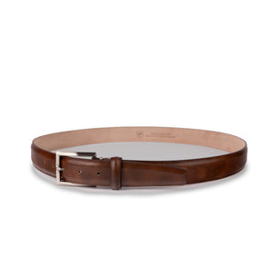 The LEN LIFESTYLE Italian Marbled Calf Belt in Pecan features genuine leather with a silver buckle, displayed in a circular shape on a white background for a classic vintage look.