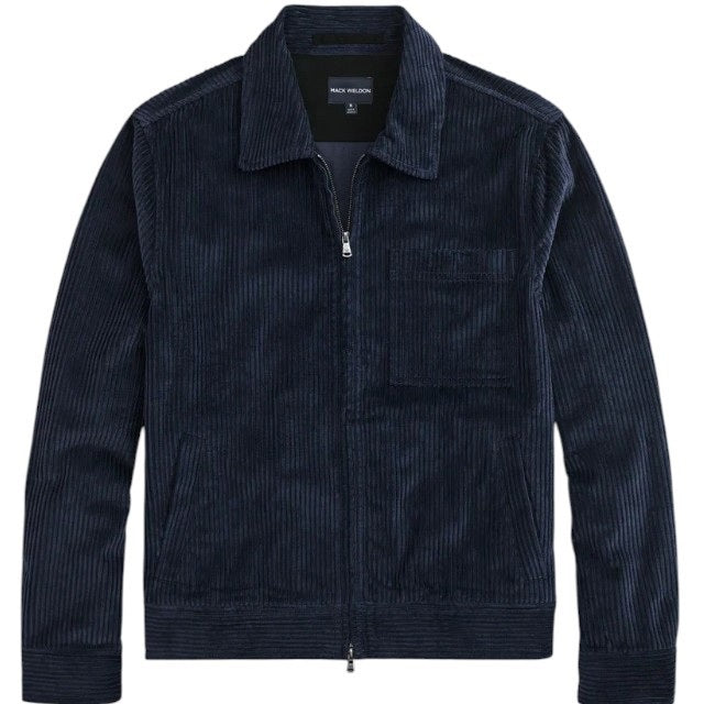 The MACK WELDON - CORDUROY ZIP JACKET is a modern-fit, dark blue corduroy jacket with a front zipper, long sleeves, collar, and chest pocket—shown against a white background.