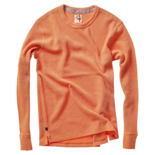 The RELWEN - BI-WAFFLE CREW IN CITRUS, a long-sleeved, citrus orange waffle-knit cotton sweater from RELWEN, is laid flat on a white background. It features ribbed cuffs, hem, and collar with a small visible fabric tag near the hem.