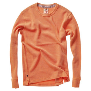 The RELWEN - BI-WAFFLE CREW IN CITRUS, a long-sleeved, citrus orange waffle-knit cotton sweater from RELWEN, is laid flat on a white background. It features ribbed cuffs, hem, and collar with a small visible fabric tag near the hem.