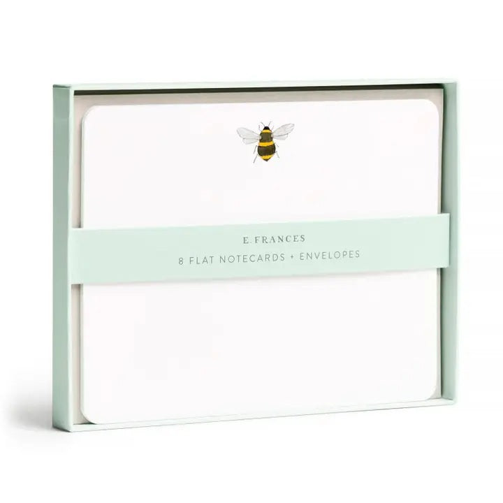 The E. FRANCES - FLAT NOTES BEE by E. FRANCES PAPER features illustrated bee stationery with a yellow honeycomb pattern on the back—perfect for hand-written notes. Set is pictured partially opened.
