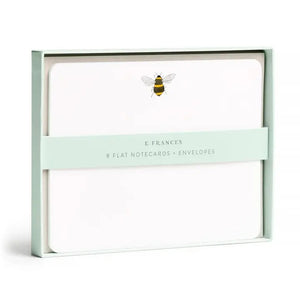 The E. FRANCES - FLAT NOTES BEE by E. FRANCES PAPER features illustrated bee stationery with a yellow honeycomb pattern on the back—perfect for hand-written notes. Set is pictured partially opened.