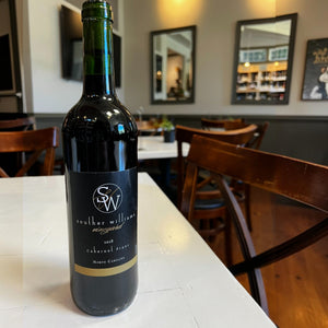 A bottle of SOUTHER WILLIAMS CABERNET FRANC 2018 with a black label featuring the logo, vintage, and wine variety.