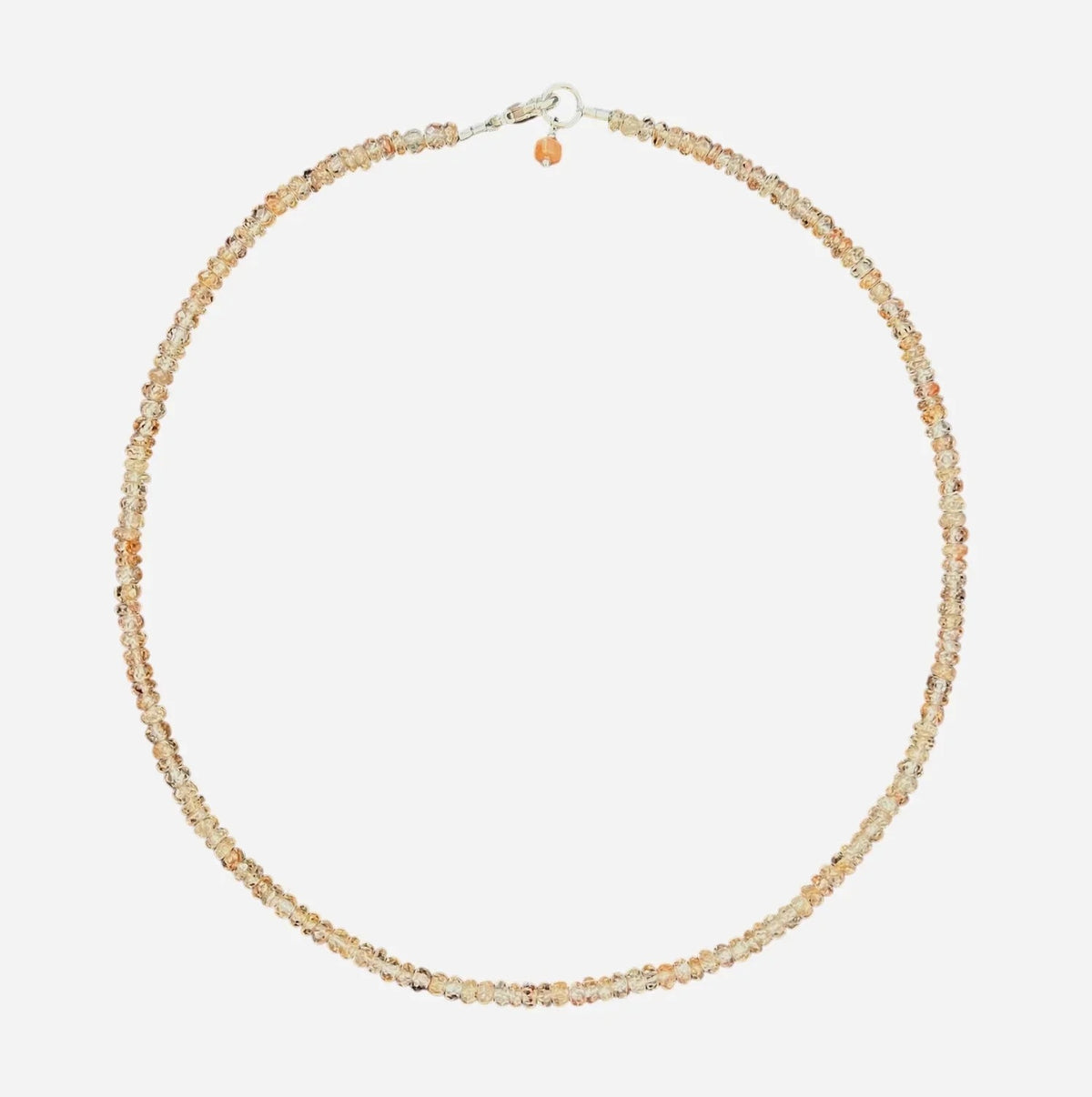 The ANN LIGHTFOOT Faceted Zircon Ras Du Cou Necklace 16" features delicate round beads in light brown and peach tones, arranged in a single strand with a simple sterling silver clasp.