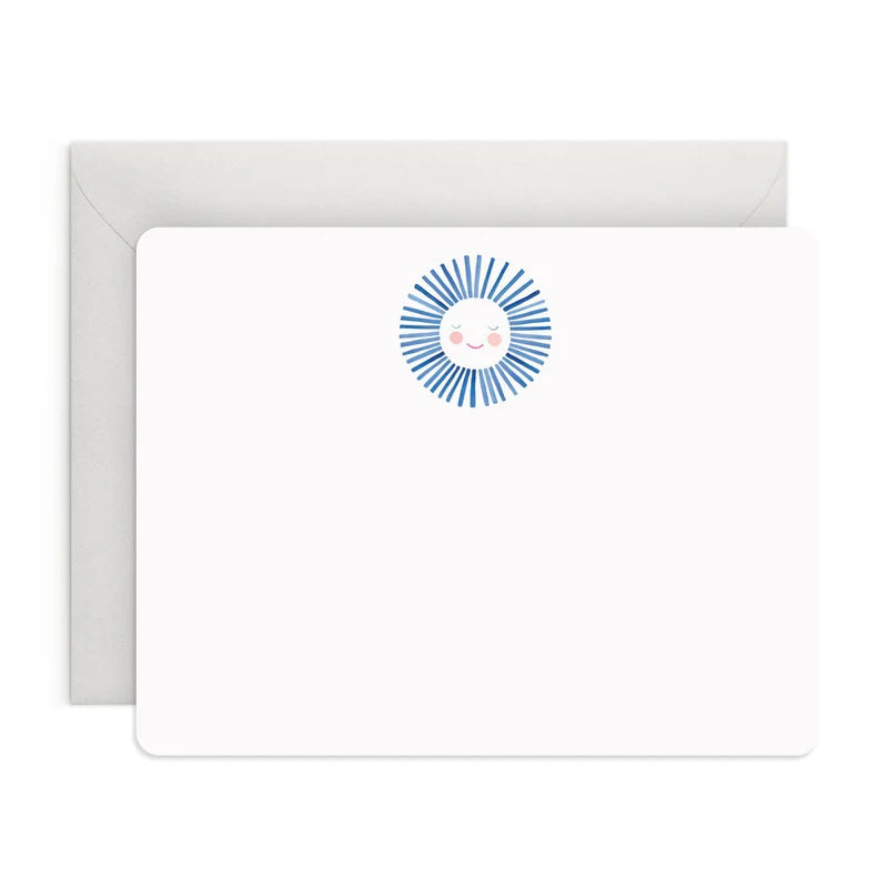 The E. FRANCES - FLAT NOTES BLUE SUNSHINE by E. FRANCES PAPER features a blank notecard with rounded corners and a cheerful sun at the top, paired with a plain white envelope—perfect illustrated stationery for hand-written notes on any occasion.