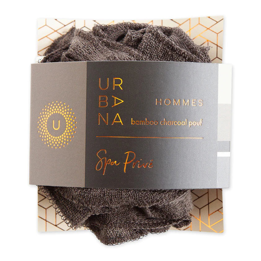 A black bamboo pouf, an eco-friendly bath accessory, nestled inside grey and gold packaging. The label reads &quot;EUROPEAN SOAPS, LLC&quot; with a sleek design that includes geometric patterns and the words &quot;Hommes&quot; and &quot;Spa Privé&quot;.