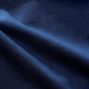 Close-up of COLLARS AND CO's PALM PIMA BLEND QUARTER ZIP IN NAVY, featuring dark blue fabric with a soft, textured surface and subtle sheen—perfect for lightweight layering and modern comfort.