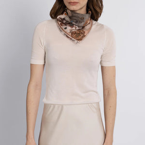 A fluffy gray kitten with a ribbon sits among vintage-style botanical illustrations on the 100% Silk Twill Sabina Savage - Ring a Ring O' Roses scarf, featuring an ornate banner and elegant flowers and ribbons.