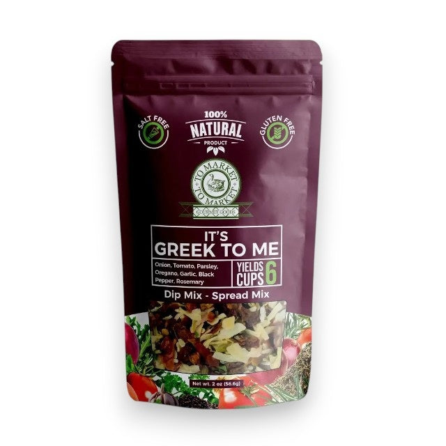 A purple bag of TO MARKET - IT’S GREEK TO ME DIP MIX by TO MARKET- DIPS &amp; SPREADS sits beside a bowl of white dip served with crackers. The packaging highlights a 6-cup yield and features key ingredients like onion, parsley, and oregano, making it an ideal foundation for a Mediterranean spread—just add feta cheese and kalamata olives for an authentic flair.