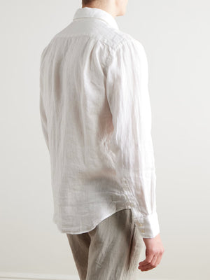 The HARTFORD - PAUL LINEN SHIRT IN WHITE by HARTFORD is a long-sleeved, button-up men's shirt crafted from premium European Flax linen, featuring a collar and single chest pocket, shown flat on a plain light grey background.